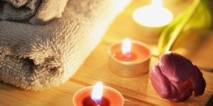 Candle, flowers and towel